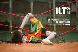 ilt festival 25 - a dol llike person lying in strings