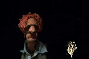 slose up of hand puppet with red hair