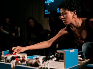 young woman playing board game - The Game - Teatret Gruppe 38