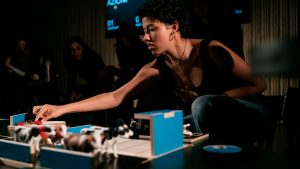 young woman playing board game - The Game - Teatret Gruppe 38