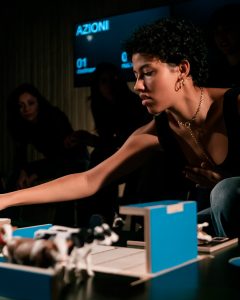 young woman playing board game - The Game - Teatret Gruppe 38